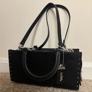 NWOT Coach Rogue 26 with Rivets